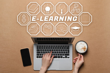 E-learning. Woman with cup of coffee working with laptop at light brown table, top view. Illustrations of different iconsの写真素材