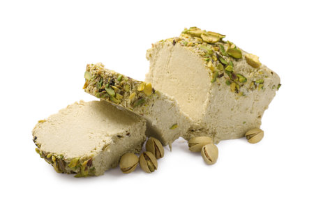 Pieces of tasty halva with pistachios on white backgroundの写真素材