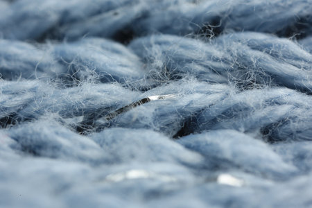 Light blue knitted fabric as background, macroの写真素材