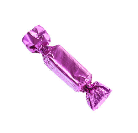 Tasty candy in violet wrapper isolated on whiteの写真素材