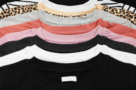 Many stacked clothes as background, top view