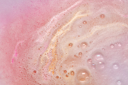 Colorful foam after dissolving bath bomb in water, closeupの写真素材