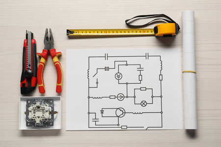 Wiring diagram and tools on white wooden table, flat layの写真素材