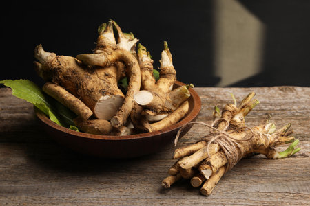 Fresh horseradish roots on wooden table, closeupの写真素材