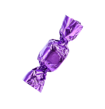 Tasty candy in purple wrapper isolated on whiteの写真素材