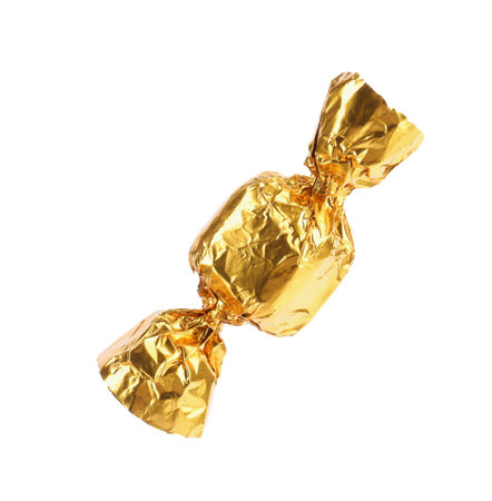 Tasty candy in golden wrapper isolated on whiteの写真素材