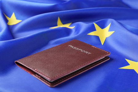 Immigration to Europe. Passport on flag, closeupの写真素材