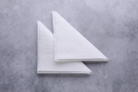 Clean paper tissues on gray table, flat layの写真素材