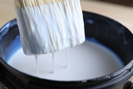 Dipping brush into can with varnish, closeupの写真素材