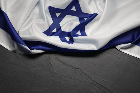 Flag of Israel on gray textured background, above view and space for text. National symbolの写真素材