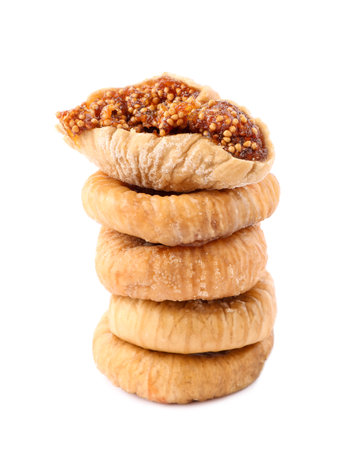 Stacked tasty dried figs isolated on whiteの写真素材