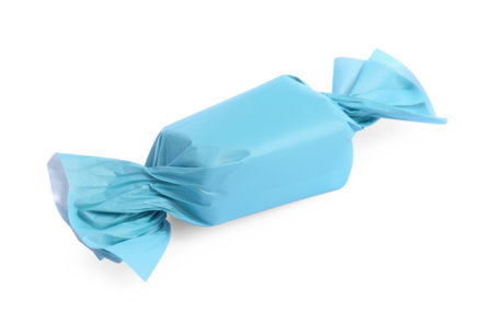 Tasty candy in light blue wrapper isolated on whiteの写真素材