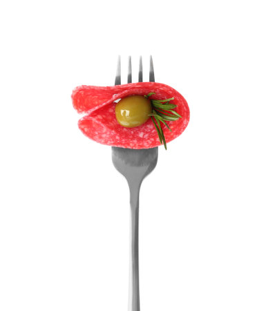 Fork with tasty slice of salami, olive and rosemary isolated on whiteの写真素材