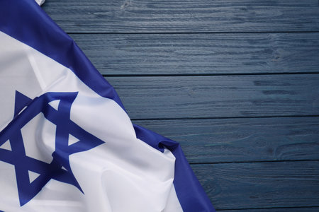 Flag of Israel on blue wooden background, top view and space for text. National symbolの写真素材