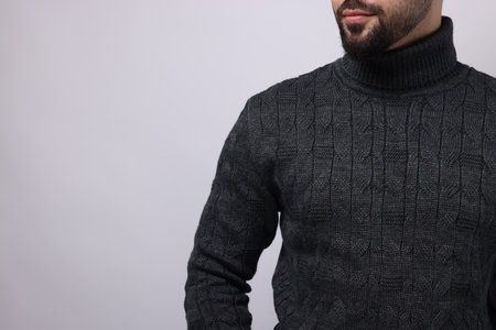 Man in stylish sweater on white background, closeup. Space for textの写真素材