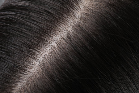 Closeup view of healthy dark woman`s hairの写真素材