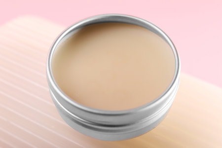 Lip balm on pink background, closeup viewの写真素材