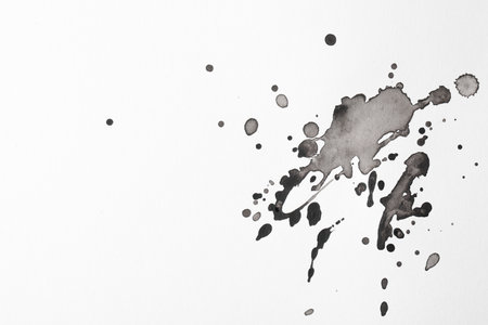 Blots of black ink on white background, flat lay. Space for textの写真素材