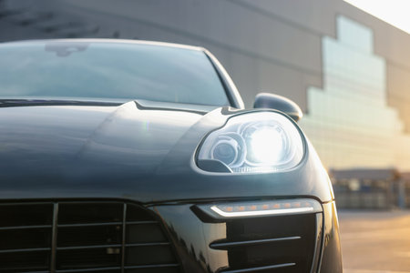 Modern black car parked outdoors, closeup viewの写真素材