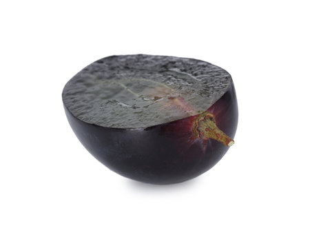 Half of dark blue grape isolated on whiteの写真素材