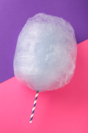 Sweet light blue cotton candy on color background, top viewの写真素材