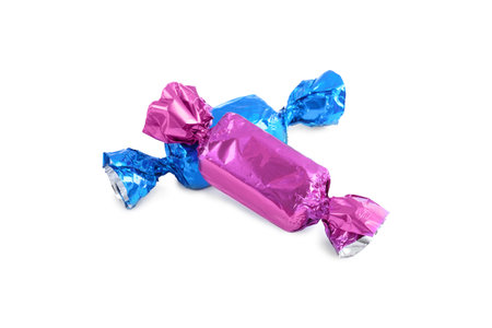 Two candies in colorful wrappers isolated on whiteの写真素材