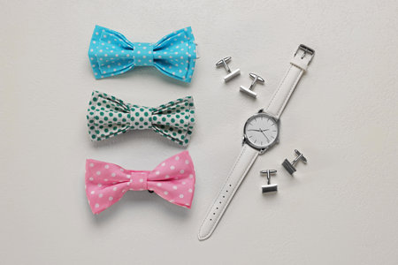 Flat lay composition with stylish color bow ties on white backgroundの写真素材