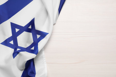 Flag of Israel on white wooden background, top view and space for text. National symbolの写真素材