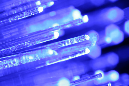 Optical fiber strands transmitting blue light, macro viewの写真素材