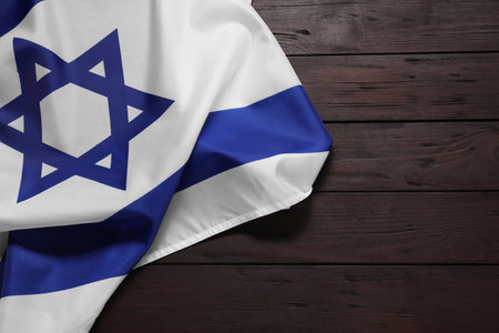 Flag of Israel on wooden background, top view and space for text. National symbolの写真素材