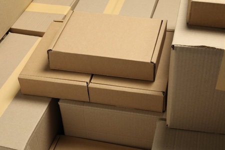 Many cardboard boxes as background, closeup. Packaging goodsの写真素材