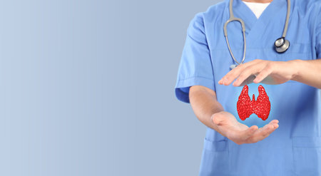 Endocrinologist holding virtual thyroid gland on light gray background, closeup. Banner design with...
