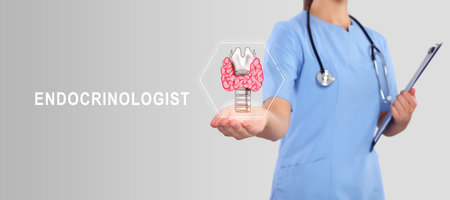 Endocrinologist holding virtual thyroid gland on light gray background, closeup. Banner designの写真素材