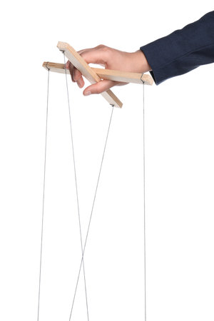 Businesswoman holding puppet control bar with strings on white background, closeup