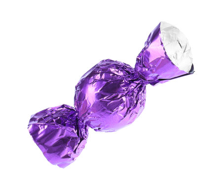Tasty candy in purple wrapper isolated on whiteの写真素材