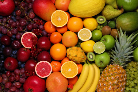 Different ripe fruits and berries as background, top viewの写真素材