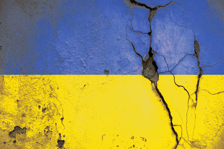 National flag of Ukraine painted on old cracked wallの写真素材