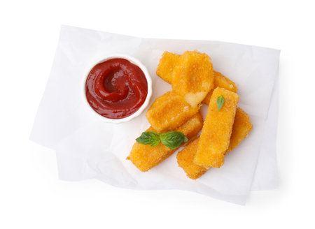 Tasty fried mozzarella sticks with basil leaves and ketchup isolated on white, top viewの写真素材