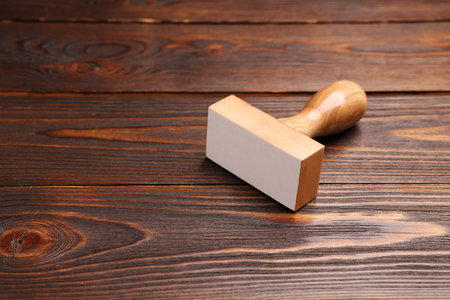 One stamp tool on wooden table, space for textの写真素材