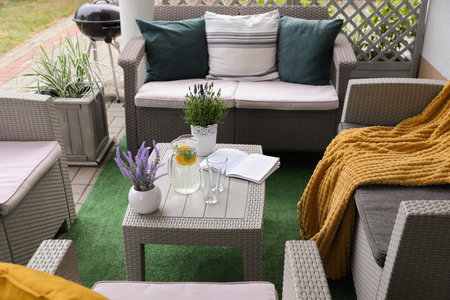 Beautiful terrace with comfortable furniture in yard