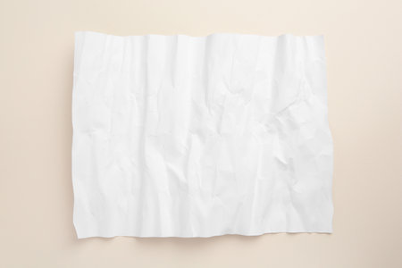 Sheet of crumpled parchment paper on beige background, top viewの写真素材