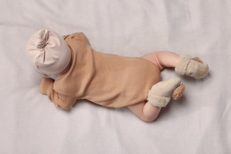 Newborn baby lying on blanket, top view