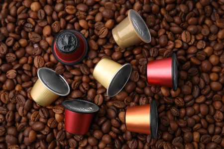 Many different coffee capsules on beans, flat layの写真素材
