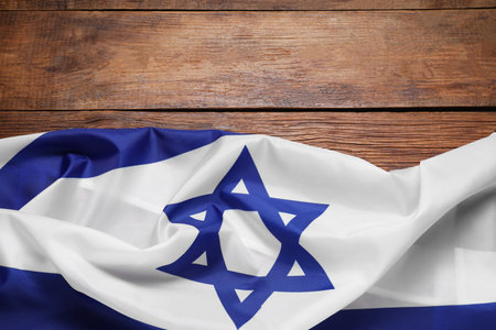 Flag of Israel on wooden background, top view and space for text. National symbolの写真素材