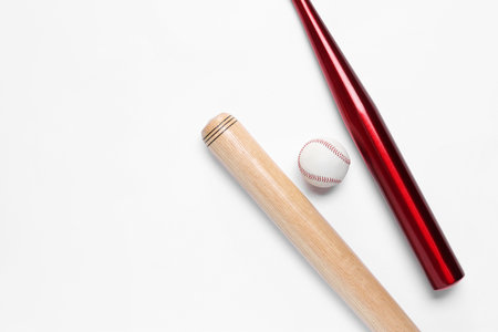 Baseball bats and ball on white background, flat lay. Space for textの写真素材