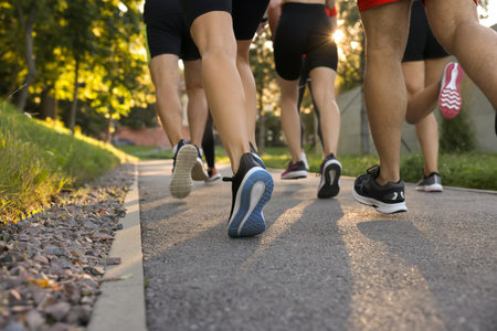 Group of people running outdoors, closeup viewの写真素材