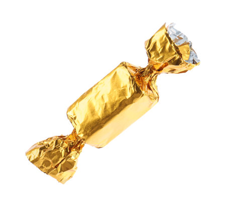 Tasty candy in golden wrapper isolated on whiteの写真素材