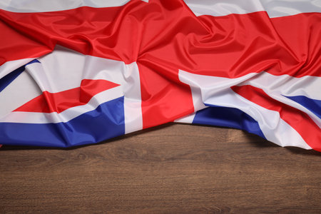 Flag of the United Kingdom on wooden background, top view. Space for textの写真素材