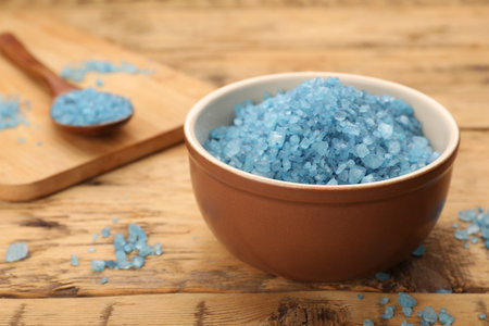 Bowl with blue sea salt on wooden table, closeupの写真素材