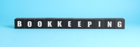 Word Bookkeeping made with black cubes on light blue backgroundの写真素材